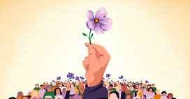 Purple flower with people in background